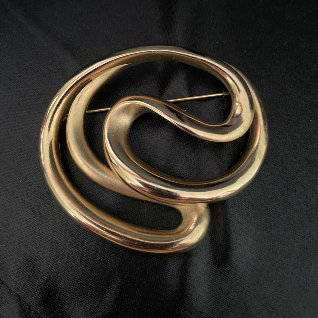 Sophisticated Gold-Tone Swirl Brooch